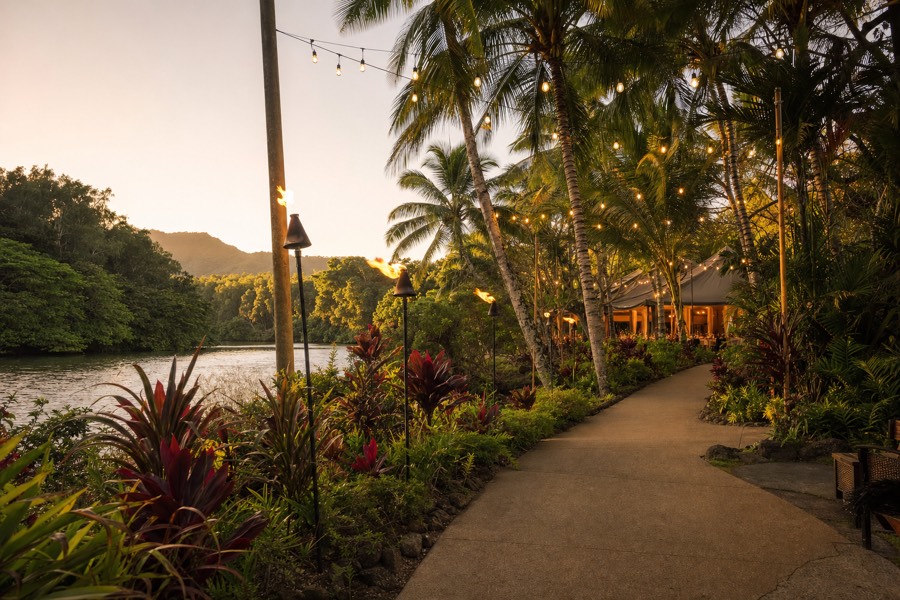 A tropical garden luau setting on the Wailua River on Kauai at golden hour