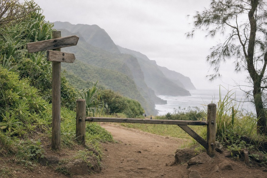 Trail sign and entrance gate at Ha'ena State Park near Ke'e Beach on Kauai's north shore