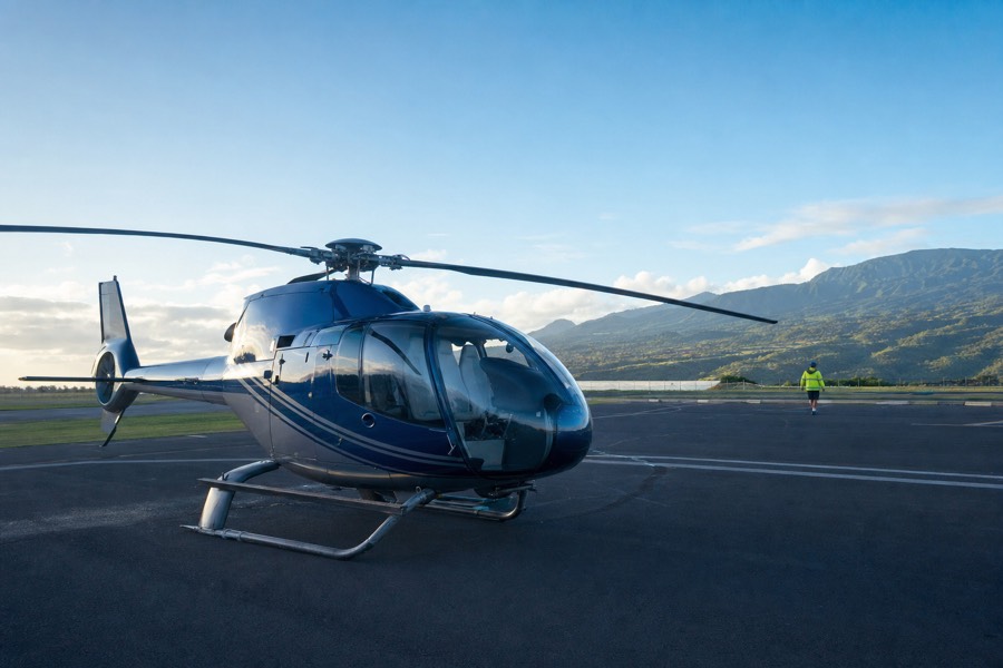 Passengers boarding a sightseeing helicopter on the tarmac at Lihue Airport on Kauai